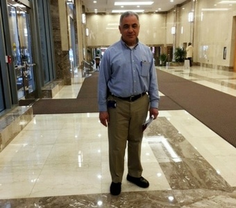 Juan stands in the lobby of a Class A office building, which he helps maintain and serve year around.