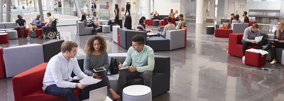 Students sitting in university atrium