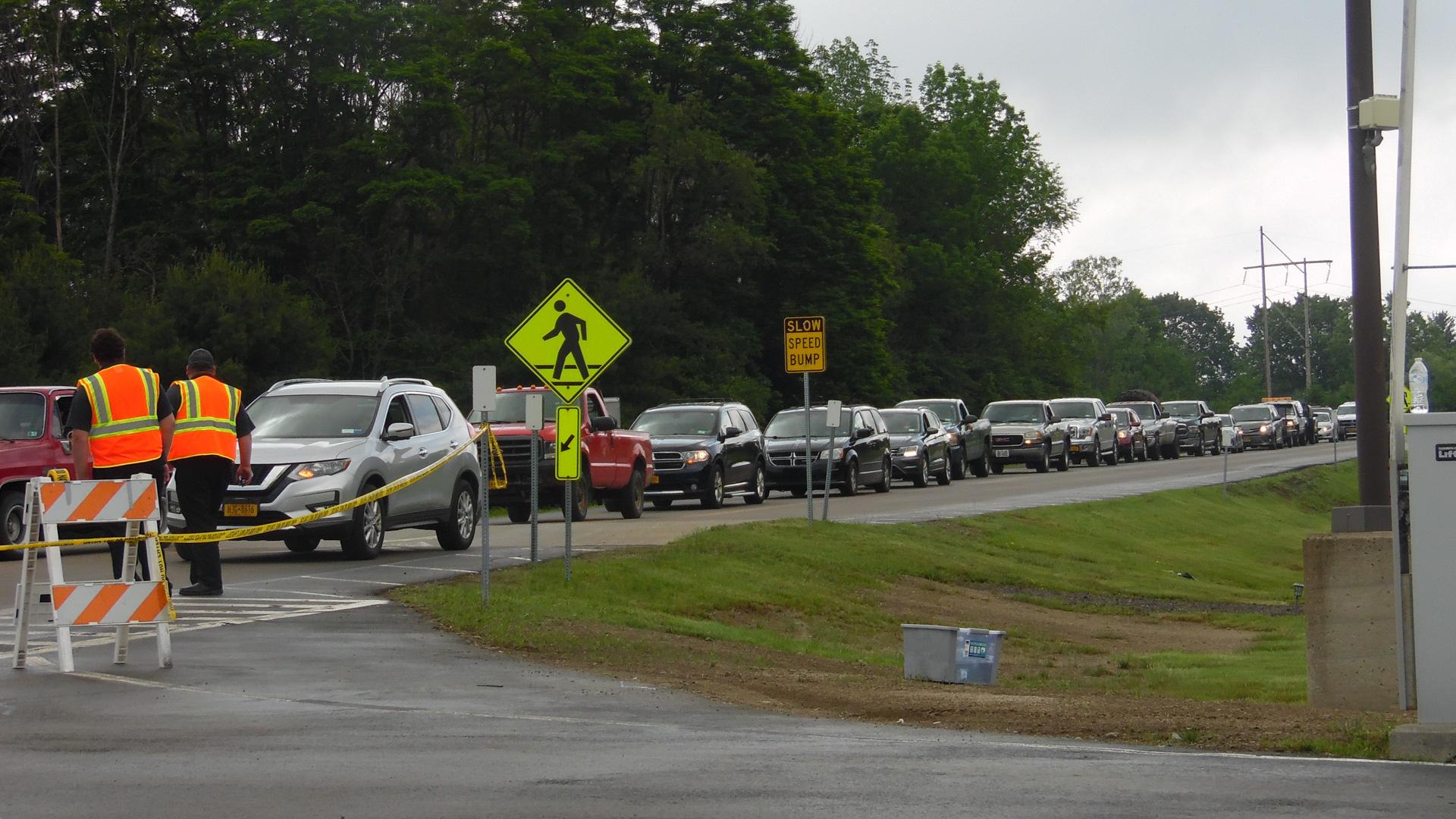 Cars from nearby towns line up to turn in difficult-to-recycle items at the Cummins facility