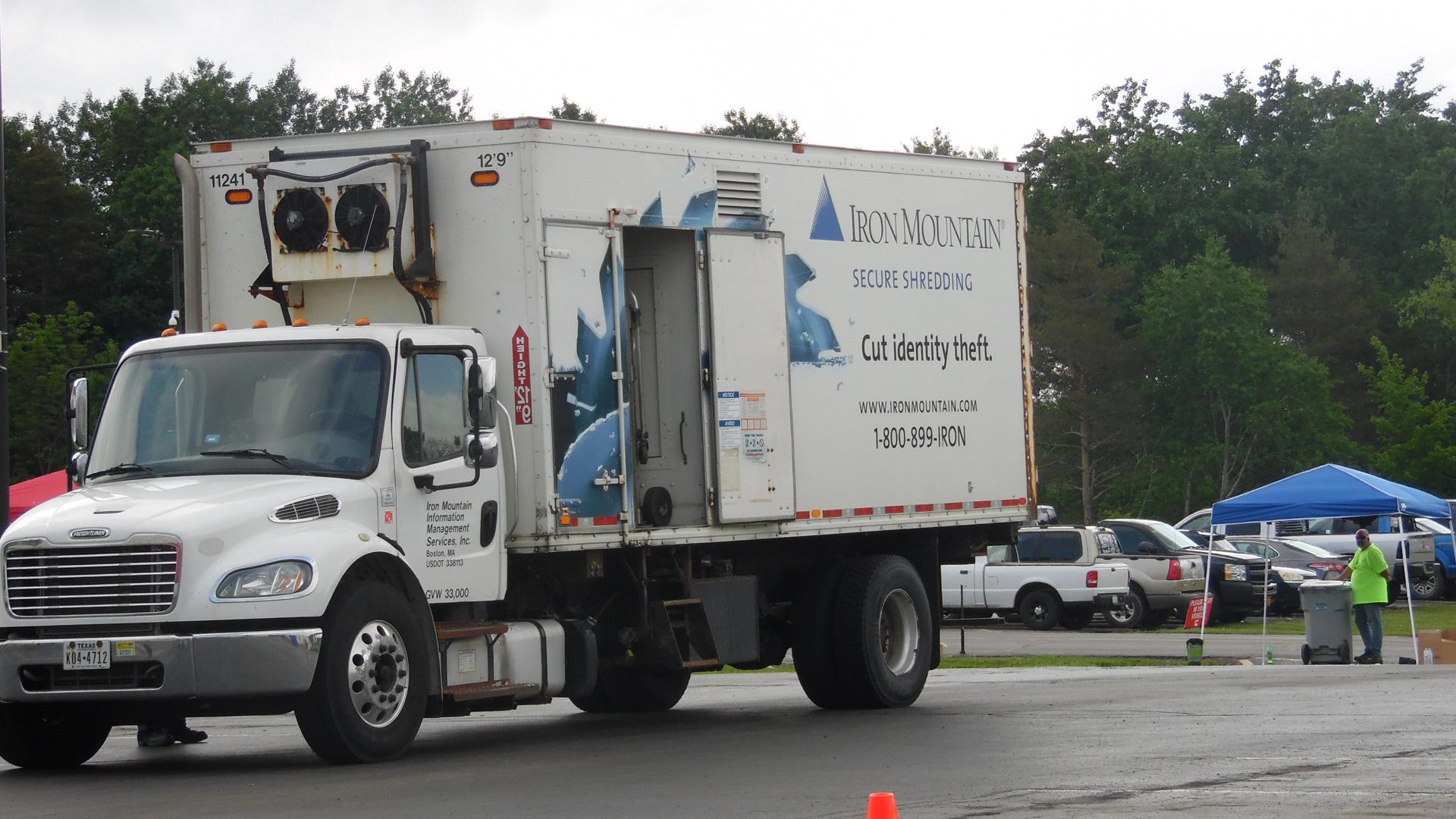 An Iron Mountain truck collects sensitive documents to safely destroy at their facility