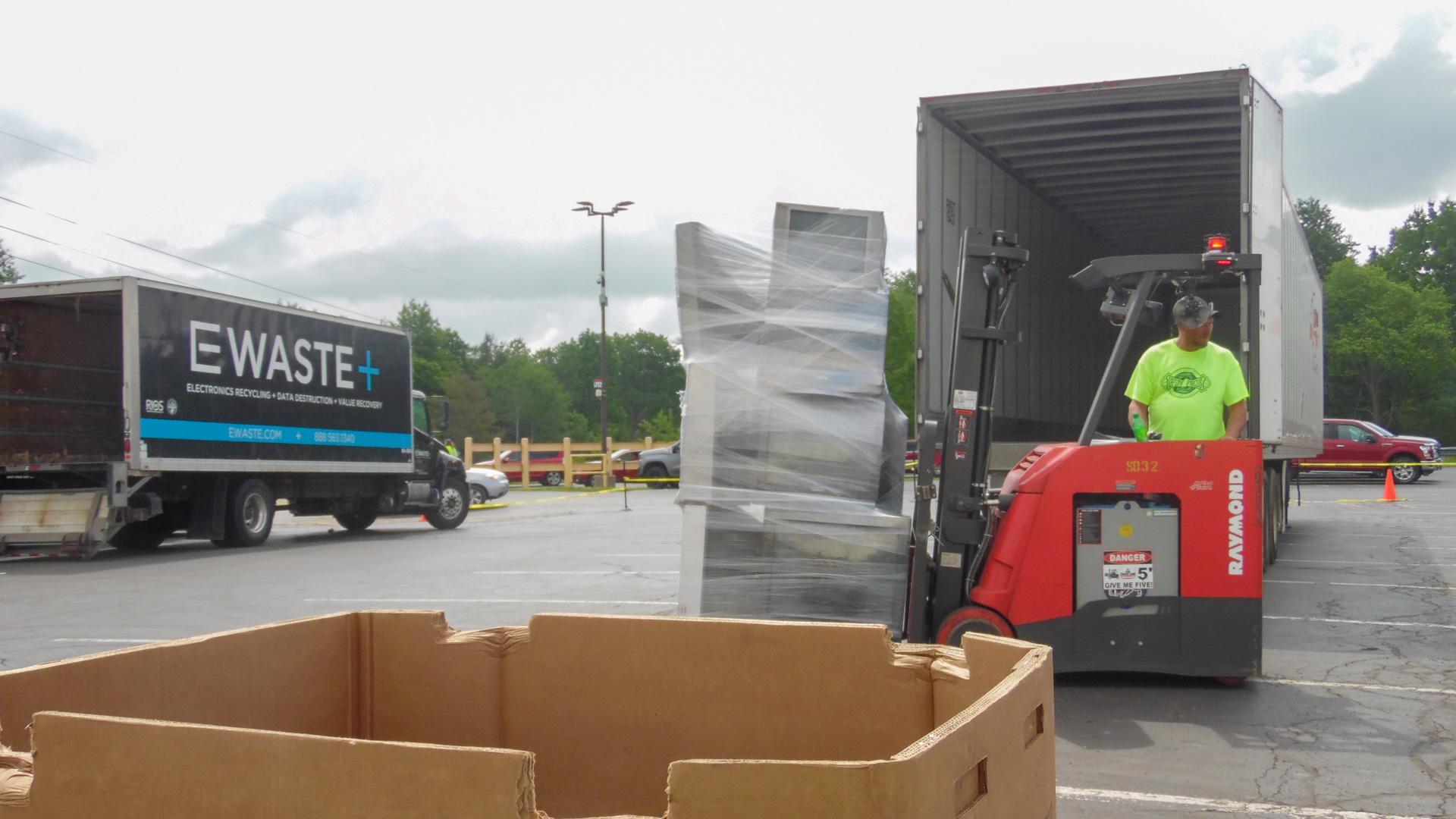 An E-Waste.com box truck collects electronics for dismantling and recycling at their facility