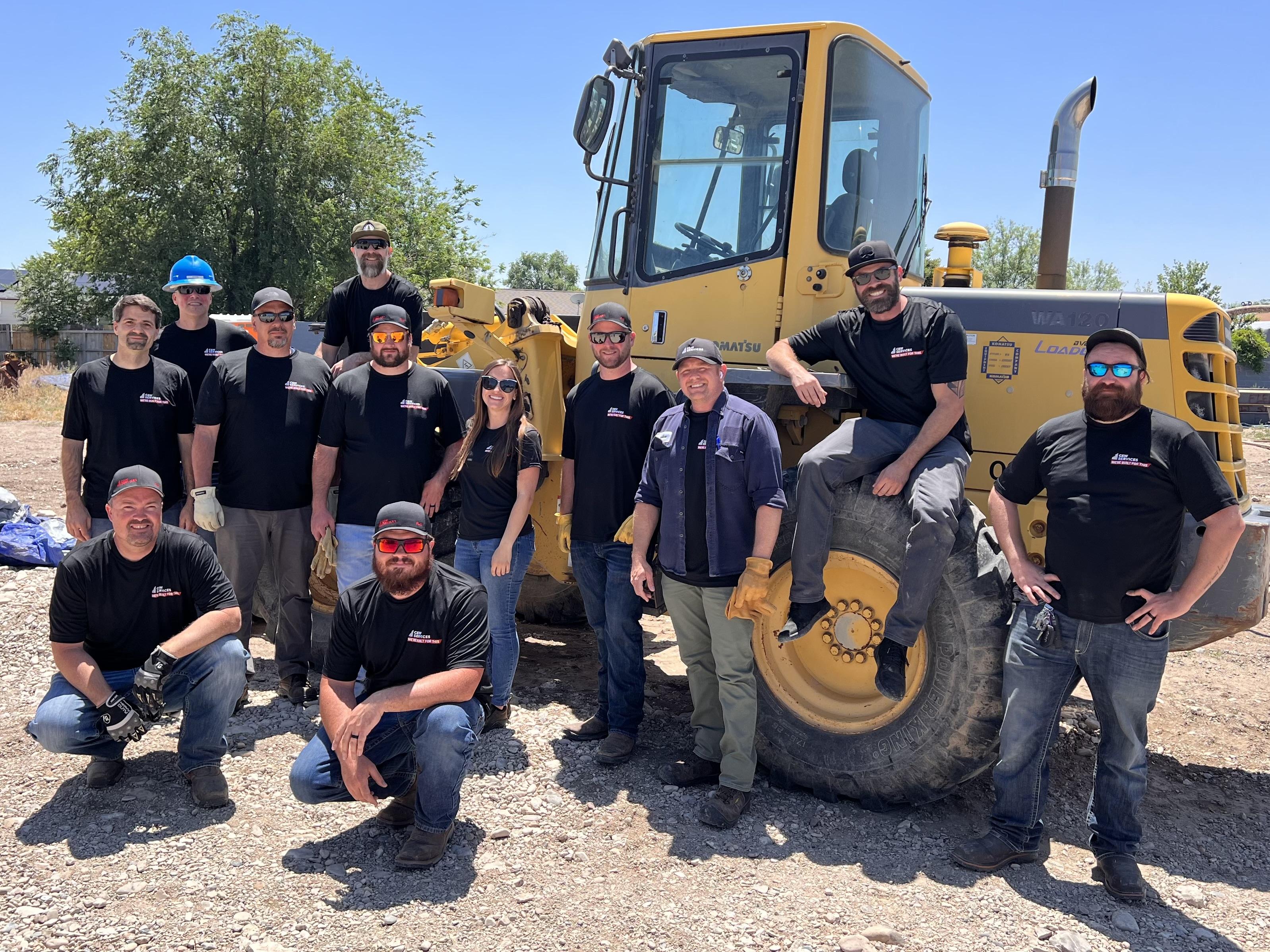 (Pictured from left to right) Back row: Dan Cahill, Bryan West, Chris Harrison, David Miles, Seth Hankins, Liz Nenni, Travis Smith, Dustin Walker, James Smith, and Charles Wilson. Then in front there’s Front row: Eric Cannon and Brad Batronis.