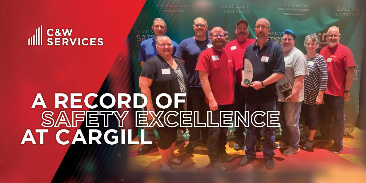 Cargill team members posing with a Safety award with text overlay 'A record of safety excellence at Cargill'
