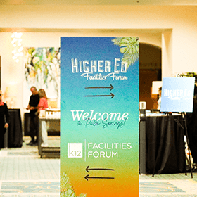 A sign that says welcome to higher ed facilities forum.