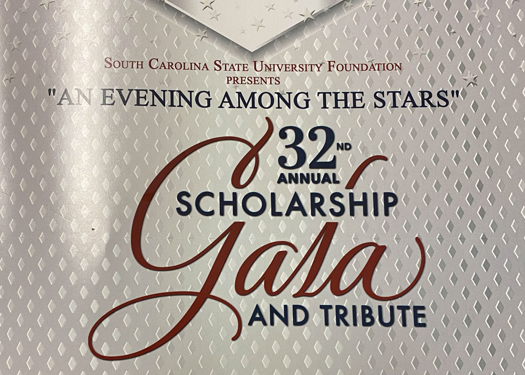 A poster for the 32nd annual scholarship gala and tribute.