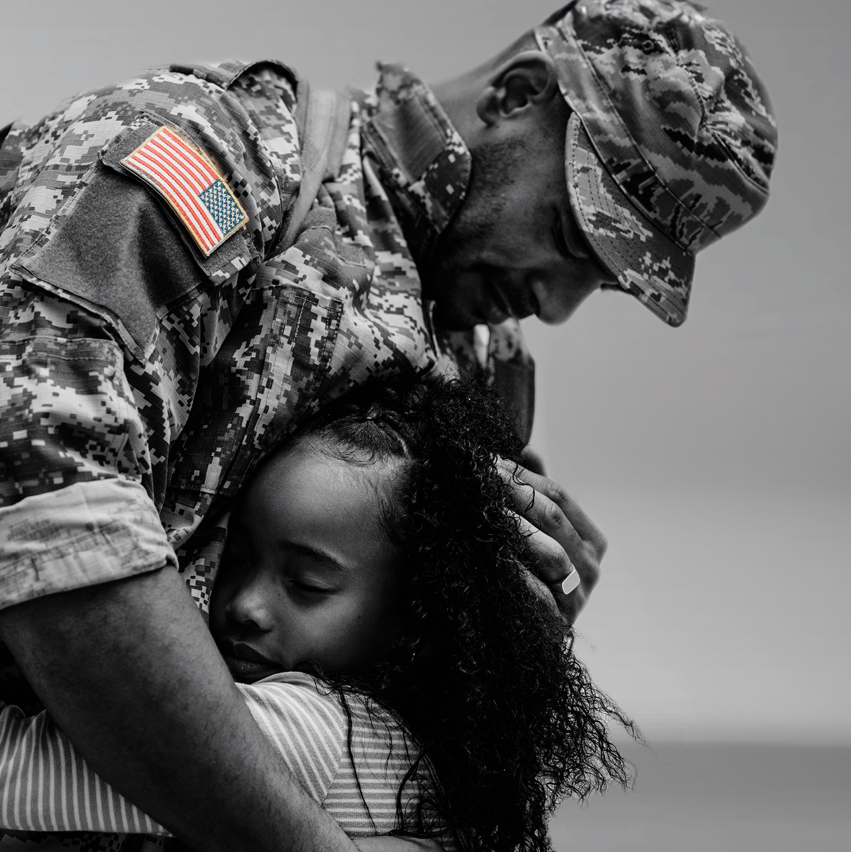 A soldier holding a child