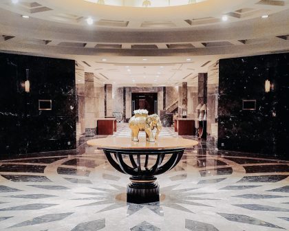 A marble floor with a statue in the middle of it.