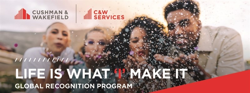 Group of joyful people blowing confetti towards the camera with a banner reading "life is what you make it - global recognition program" for Cushman & Wakefield.
