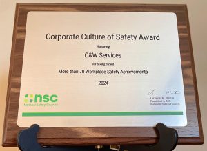 Plaque titled "Corporate Culture of Safety Award" presented to C&W Services for over 70 workplace safety achievements in 2024 by the National Safety Council.