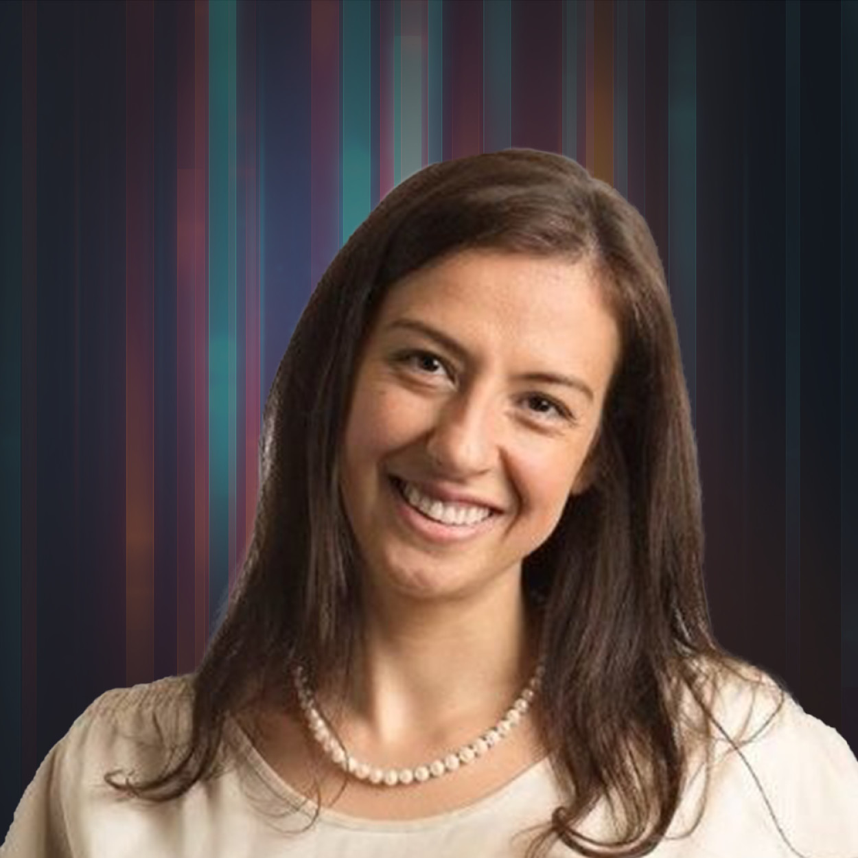 Smiling woman with long brown hair wearing a pearl necklace and beige top, against a striped background.