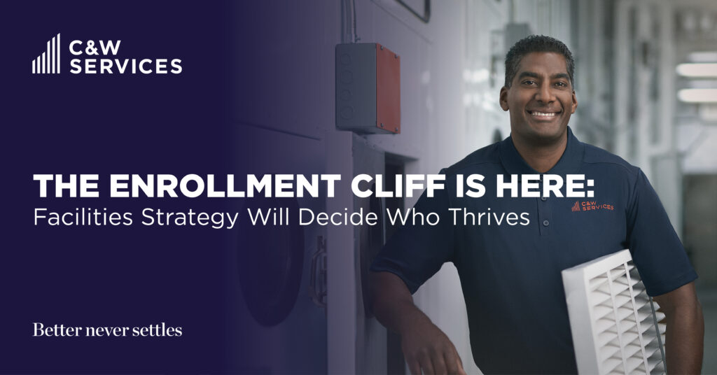 A man in a C&W Services shirt stands indoors holding a vent panel. Text reads, “The enrollment cliff is here: Facilities strategy will decide who thrives.
